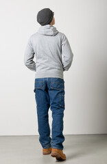 Young adult male in opoiedi seen from behind. Whole body isolated on white background