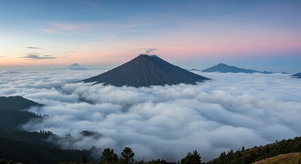 Majestic volcano peaks above cloud layer at sunrise in serene mountain landscape