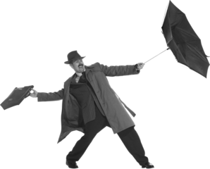 Bad weather. Young man dressed in 50s, 60s style fights the wind with umbrella isolated on transparent background. Concept of retro and vintage, fashion, lifestyle