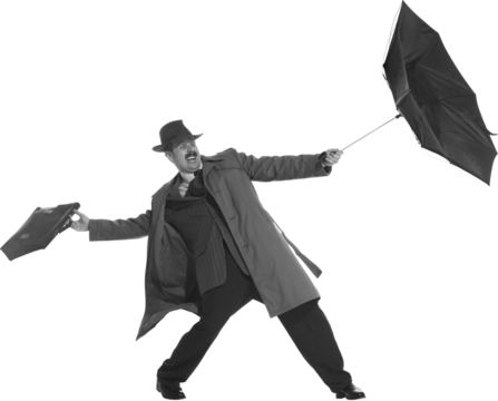 Bad weather. Young man dressed in 50s, 60s style fights the wind with umbrella isolated on transparent background. Concept of retro and vintage, fashion, lifestyle