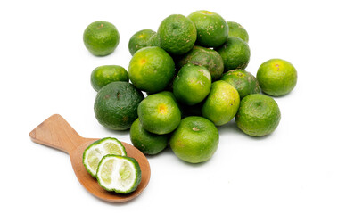 Lime or Limau (Citrus amblycarpa) isolated on white background. Used for spice in cooking, Lime or Limau (Citrus amblycarpa) is one of the native Citrus species of West Java, Indonesia.