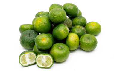 Lime or Limau (Citrus amblycarpa) isolated on white background. Used for spice in cooking, Lime or Limau (Citrus amblycarpa) is one of the native Citrus species of West Java, Indonesia.