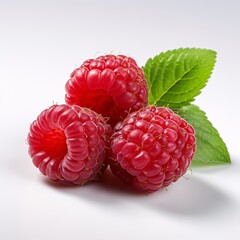 a group of raspberries with leaves