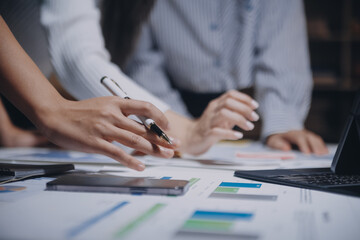 Group of young asian creative business brain storm meeting presentation,discussing roadmap to...