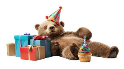 Teddy bear wearing a birthday hat with a colorful cupcake on a table.
