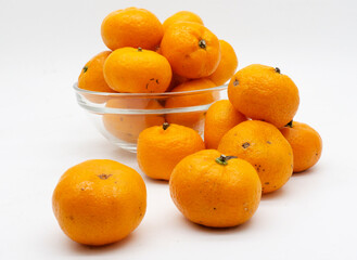 Tangerines. Close view on Fresh Mandarin Orange. Isolated on White Background. Citrus. Sweet. Juicy. Chinese. New Year. Jeruk Keprok