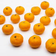 Tangerines. Close view on Fresh Mandarin Orange. Isolated on White Background. Citrus. Sweet. Juicy. Chinese. New Year. Jeruk Keprok