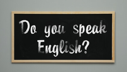 Do You Speak English? text on black chalkboard. Language course
