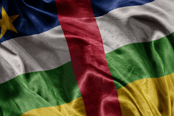 shine waving colourful realistic national flag of central african republic . macro shot