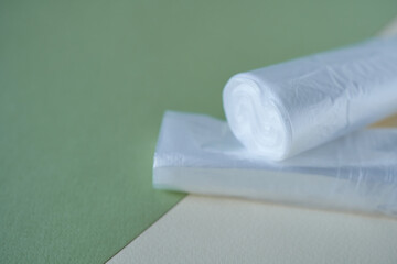 Obraz premium plastic bags on a green and white background, close-up