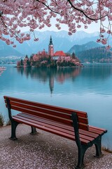 Obraz premium Empty bench overlooking lake bled island in spring bloom