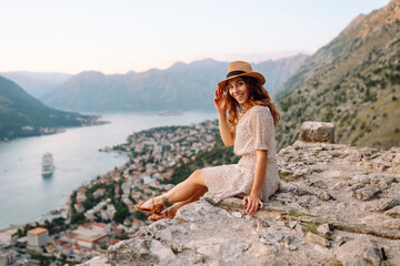 Beautiful female tourist enjoys the view of the city. Europe travel. Lifestyle, vacation, weekend.