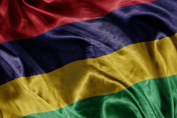 shine waving colourful realistic national flag of mauritius . macro shot