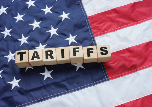 Import Trade Tariffs increase concept with United States of America Flag. Trade wars