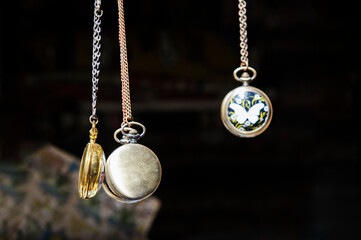 Antique pocket watches and chains hanging in a vintage store in the Tel-Aviv-Yafo flea market in...