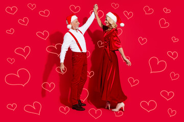 Fototapeta premium Full body photo of mature husband wife have fun dance event xmas atmosphere isolated over red color background