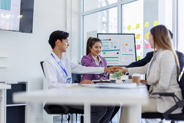 Asian Team work, presentation and meeting with office desk, collaboration and laptop or brainstorming for online project. Employee, working together research on tech for info, coworking and company.