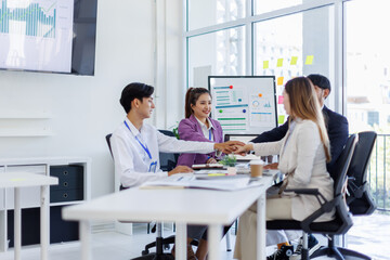 Asian Team work, presentation and meeting with office desk, collaboration and laptop or brainstorming for online project. Employee, working together research on tech for info, coworking and company.