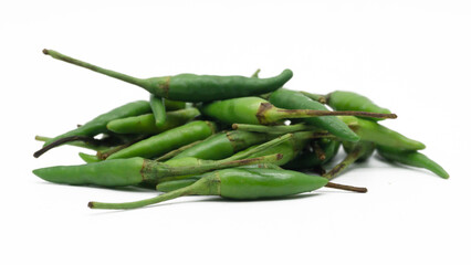 Fototapeta premium A pile of rawit hijau or green Cayenne pepper (Capsicum frutescens) isolated on white background 