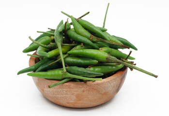 A pile of rawit hijau or green Cayenne pepper (Capsicum frutescens) isolated on white background
