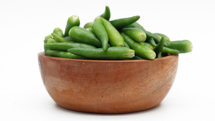 A pile of rawit hijau or green Cayenne pepper (Capsicum frutescens) isolated on white background
