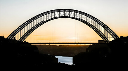 Naklejka premium Silhouetted Arch Bridge Stands Majestically Against a Golden Sunset Over a Tranquil River