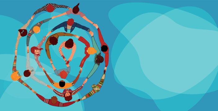 Group people in circle from diverse culture holding hands.Top view.Teamwork and cooperation.Community of friends or volunteers committed to social issues for peace and the environment