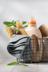 Basket with eco-friendly cleaning tools on white background. Zero waste cleaning, spring cleaning...