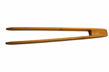 Close-up of wooden bamboo tongs, perfect for frying, serving, or grilling, captured against a white background. A simple yet stylish image showcasing eco-friendly kitchen tools.