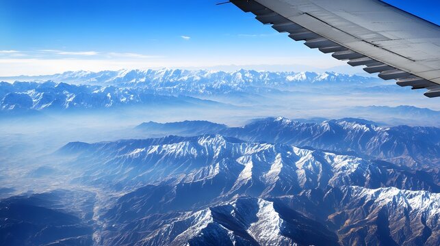 Aerial View of Majestic Snow-Capped Mountains - Powered by Adobe
