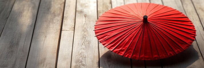 Red Japanese Umbrella on Wooden Surface with Natural Lighting