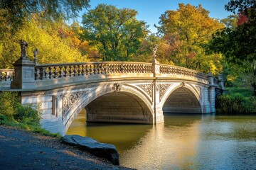 Fototapeta premium A historic stone bridge with elegant arches, spanning over a calm river with trees lining the banks
