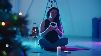 Evening yoga practice by candlelight during holiday season at home