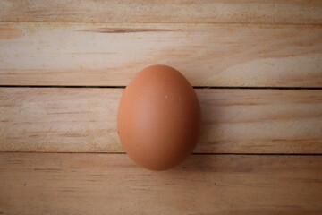 Fresh eggs on wood background