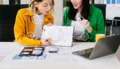  UX developer and ui designer brainstorming about mobile app interface wireframe design