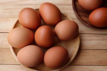 Fresh eggs on wood background
