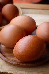 Fresh eggs on wood background
