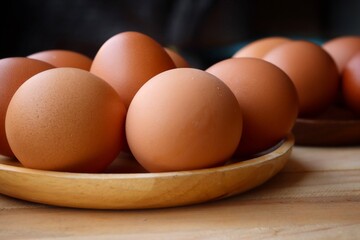 Fresh eggs on wood background