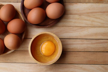 Fresh eggs on wood background