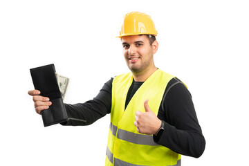 Builder man holding leather wallet with cash money like gesture