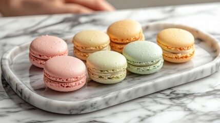Fototapeta premium Colorful macarons on a marble tray.