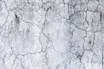 Obraz premium Weathered cracked concrete surface texture with gray tones