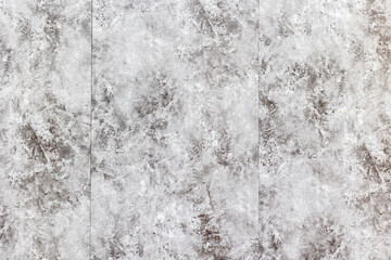 Textured grey concrete wall with subtle patterns