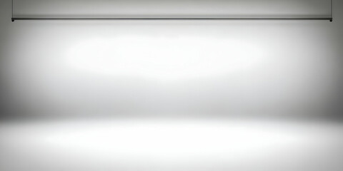 Empty Studio Background with Hanging Light Illuminates a White Cyclorama Wall for Photography and Videography.