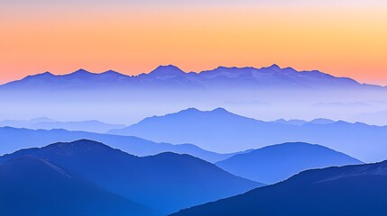 Serene Sunset Over Layered Blue Mountains