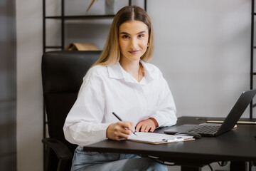 Young Businesswoman Working at Desk