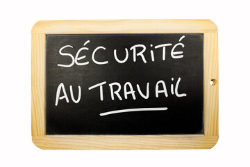 les mots sécurité au travail écrit en français sur une ardoise