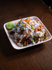 PLA SOM, Isan or Northeastern Thai sour fish, served with fresh shallot, chili pepper and lime