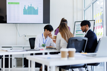 Team Of Asian Business working at the office with documents on desk, planning analyzing the financial report, business plan investment, Consultant, finance analysis concept.