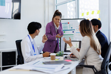 Team Of Asian Business working at the office with documents on desk, planning analyzing the financial report, business plan investment, Consultant, finance analysis concept.